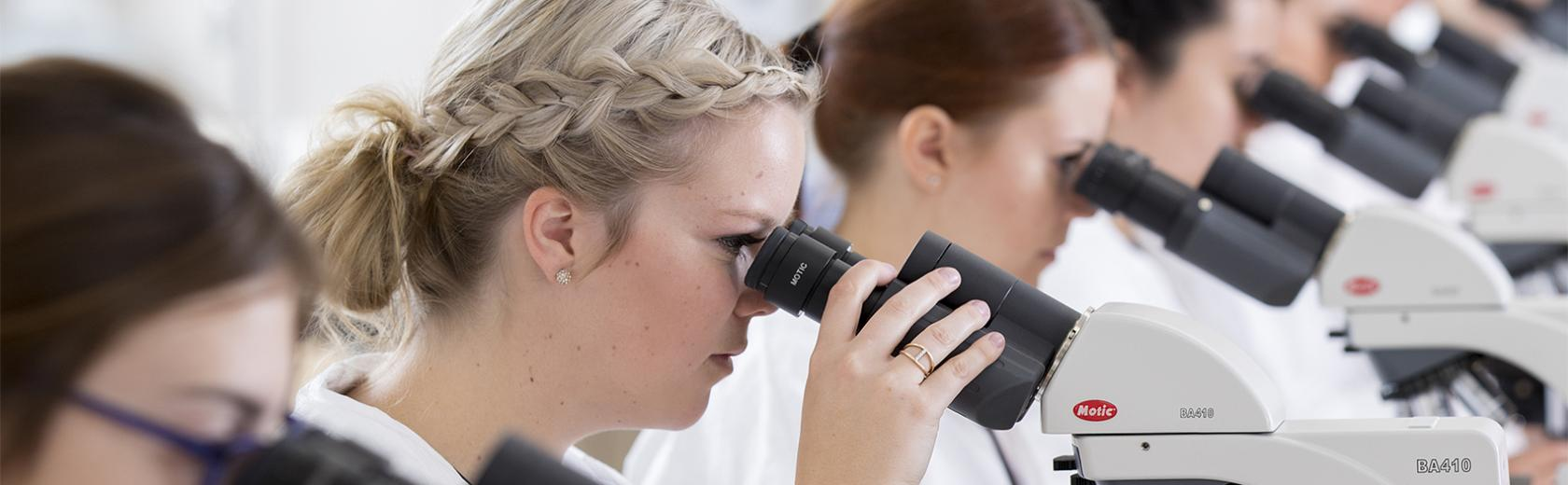 Medical Laboratory Assistant Certificate - students looking in microscropes